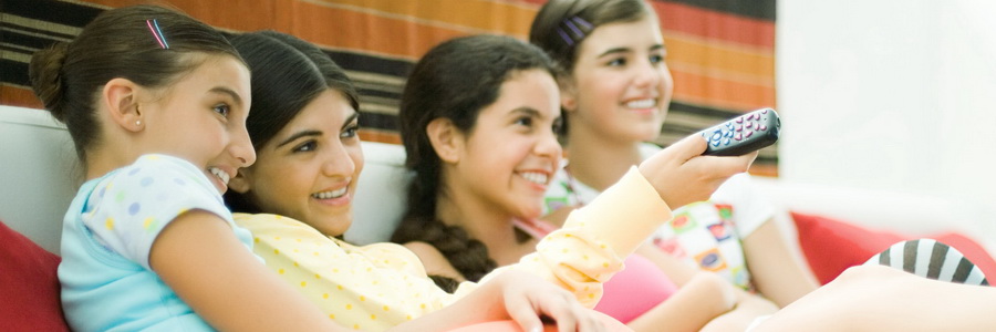 young girls watching television